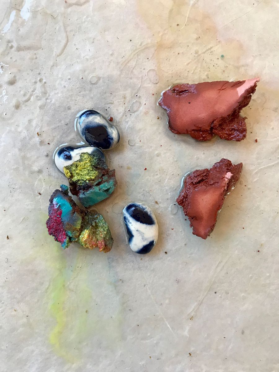 primordial soup, giant beans and painted clay poured with resin